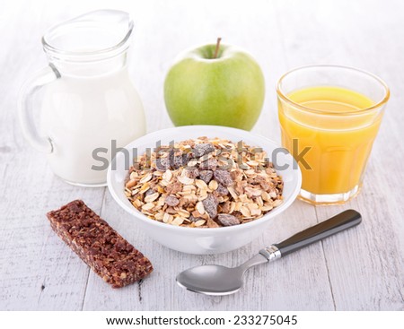 breakfast with cereal, milk and orange juice