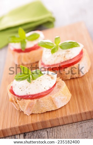 bread with tomato, mozzarella and basil