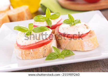 tomato, mozzarella and basil on bread