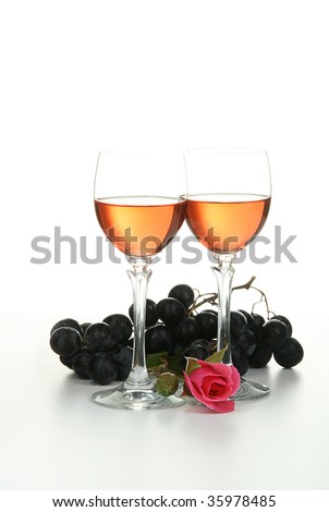 romantic evening, glasses of wine, grappes and rose isolated on white background