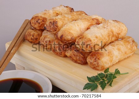 delicious spring roll, chopsticks and sauce