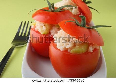 stuffed tomatoes and fork