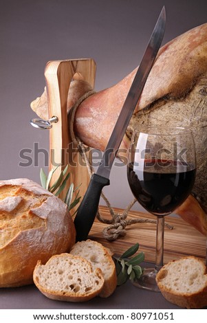 serrano ham, wine glass and bread