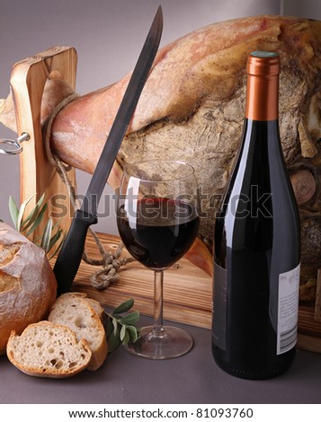 wine, glass and bottle with serrano ham and bread