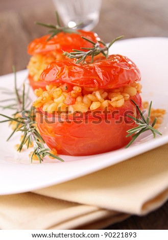 stuffed tomato with wheat and rosemary