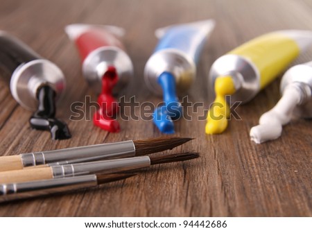 tubes of paint and brushes