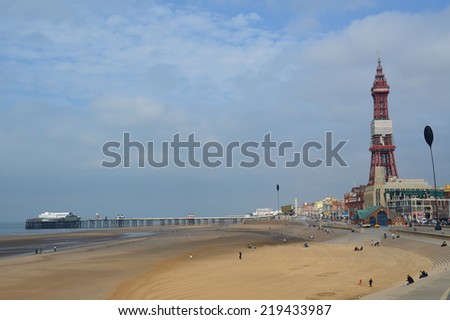the famous blackpool tower and central pier along the coast