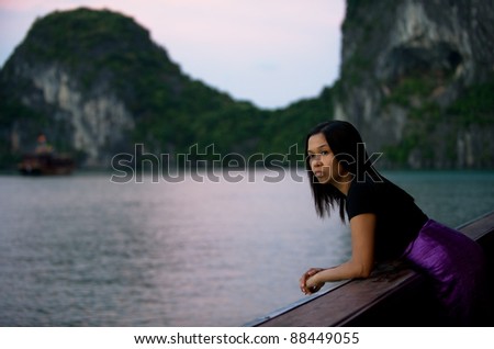 Asian woman by sea