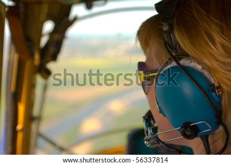 woman pilot in helicopter