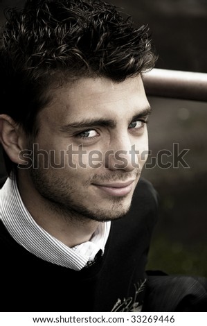 Portrait of young handsome man with blue eyes