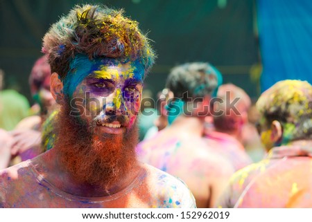 ARAMBOL, GOA - MARCH 27: Unidentified man celebrates Holi festival in Arambol Main Street, GOA, India on March 27, 2013. It\'s a religious spring holiday and also known as Festival of Colours.