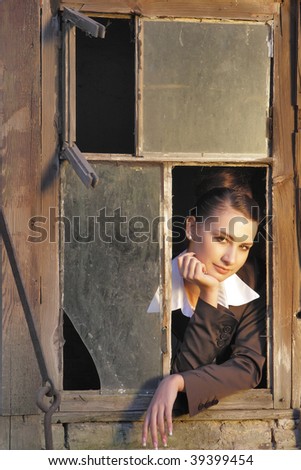girl behind a window