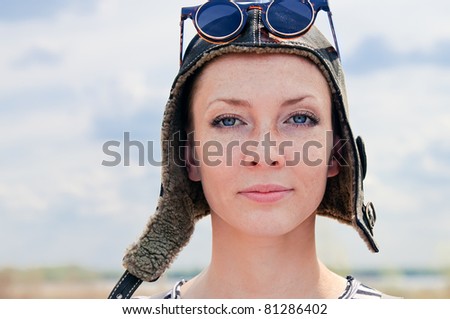 Portrait of Young woman wearing aviator hat