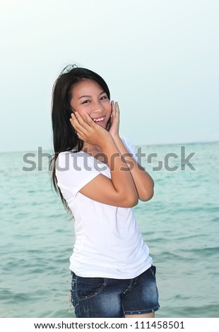 pretty young woman in smile expression on the beach