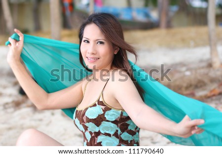 beautiful woman with green craft in smiling expression