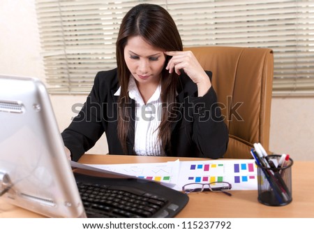 business woman thinking about something in the office