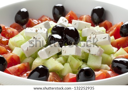 Greek salad with feta cheese, black olives, cucumber and tomatoes
