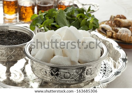 Moroccan tea set with sugar,mint and tea in traditional bowls