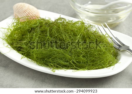 Dish with fresh filamentous green algaeas a side dish