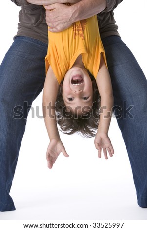 Little boy hanging upside down