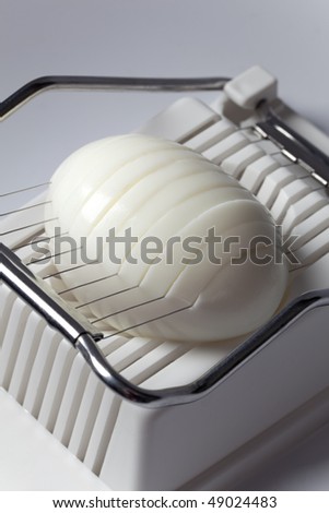 Hard boiled egg in an egg slicer