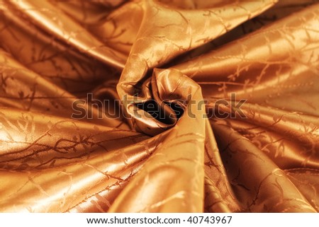 Smooth elegant orange-brown silk can be used as background