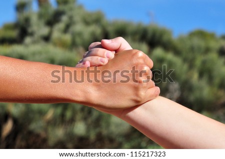 Strong united hands shake
