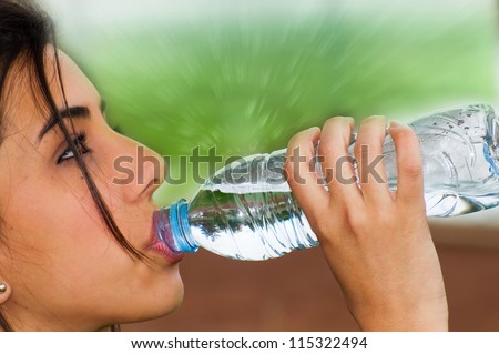 Young girl drinking water from a bottle after doing some exercise for a good health and general wellness