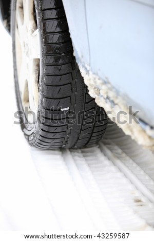 Tire prints in the snow ( winter tire ) focus on tread