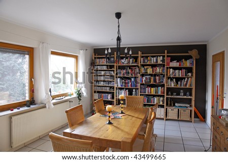 modern living-dining room with  bookshelves