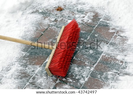 red broom for cleaning the snow\
\
\
\
\
\
please have a look at my footage  with the same scene