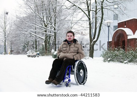disabled young man in wheelchair at the park
