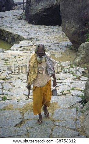 HAMPI, INDIA- JAN 05: holy sadhu walks back home after ceremony JAN 05, 2010 in Hampi, India.