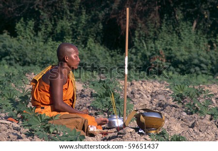 SIEM REAP, CAMBODIA- FEB 09:buddhist monk meditating during a ceremony  FEB 09, 2010 in Siem Reap, Cambodia.