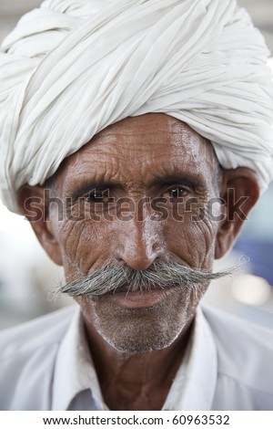 Portrait of a Rajasthani Indian man with turban and a typical Rajasthani style beard.