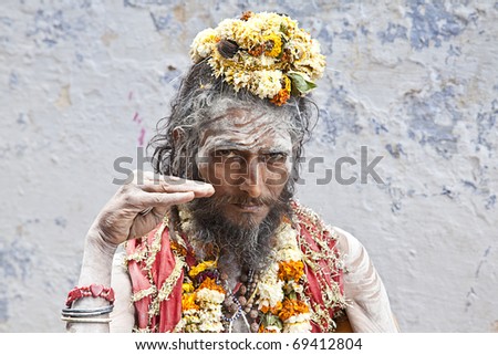 Sadhus are ascetic, practitioner of yoga and/or wandering monks,  who have left behind all material and sexual attachments and live in caves, forests and temples all over India and Nepal