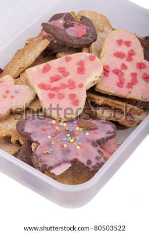 studio-shot of a food storage box full with cookies, isolated in white.