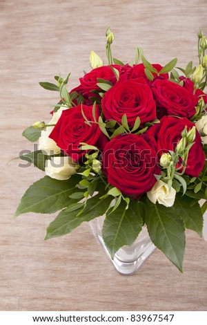 stock photo studioshot of a bridal bouquet with red and white roses on