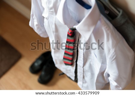 Boys school uniform on hanger