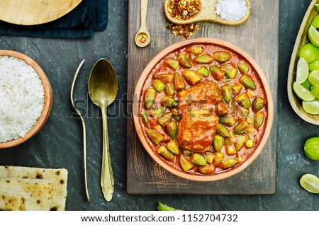 Okra stew topped with chunk of beef and served with white rice, fresh pita bread and lemon. It,s traditional Egyptian,Greek,Turkish and Romanian dish.