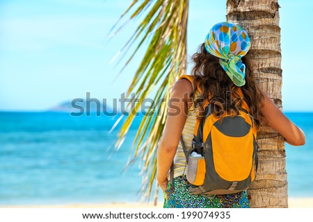 Portrait Young woman with backpack enjoying sunny day. Travel to Asia, happiness emotion, summer holiday concept