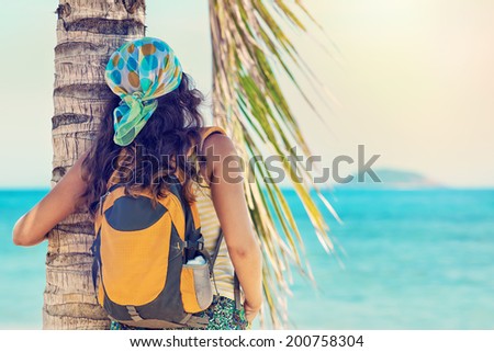 portrait Young woman with backpack enjoying sunny day. Travel to Asia, happiness emotion, summer holiday concept