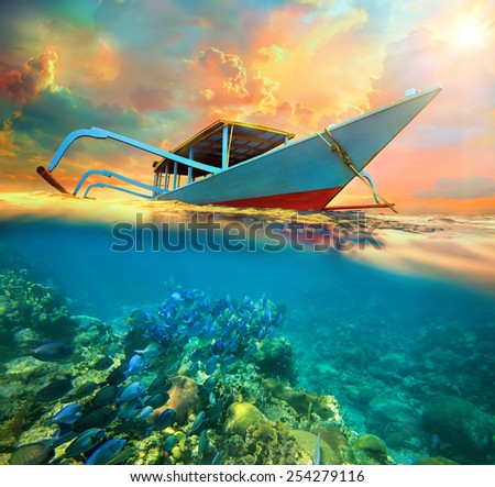 Diving boat at sunset. Traveling along Asia, active lifestyle concept
