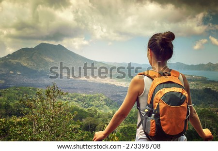 Young traveling woman with backpack. focus on backpack, happy female walking in the island to Bali, discovering world, summer vacation concept