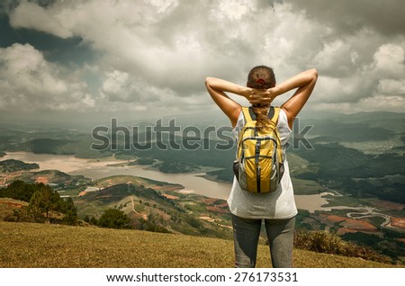 Portrait of happy traveler girl  in forest enjoying sunny day, forest landscape, travel to Europe, happiness emotion, summer holiday concept