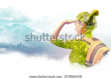 Double exposure portrait of young woman  traveler looking at Batur volcano. Indonesia.