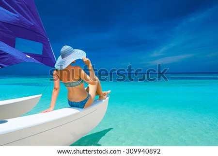 Woman traveling by boat among the islands. Travel to Asia, happiness emotion, summer holiday concept