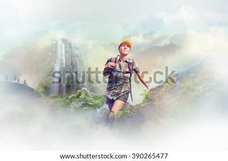 Young woman tourist with a backpack walking in the rain forest on background mountains. Concept eco tourism, hiking in the mountains.\
Concept eco tourism, hiking in the mountains.