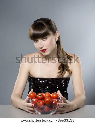 sexy young woman whith tomatoes