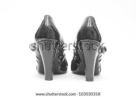Pair of Black Patent High Heel Shoes isolated on White Background